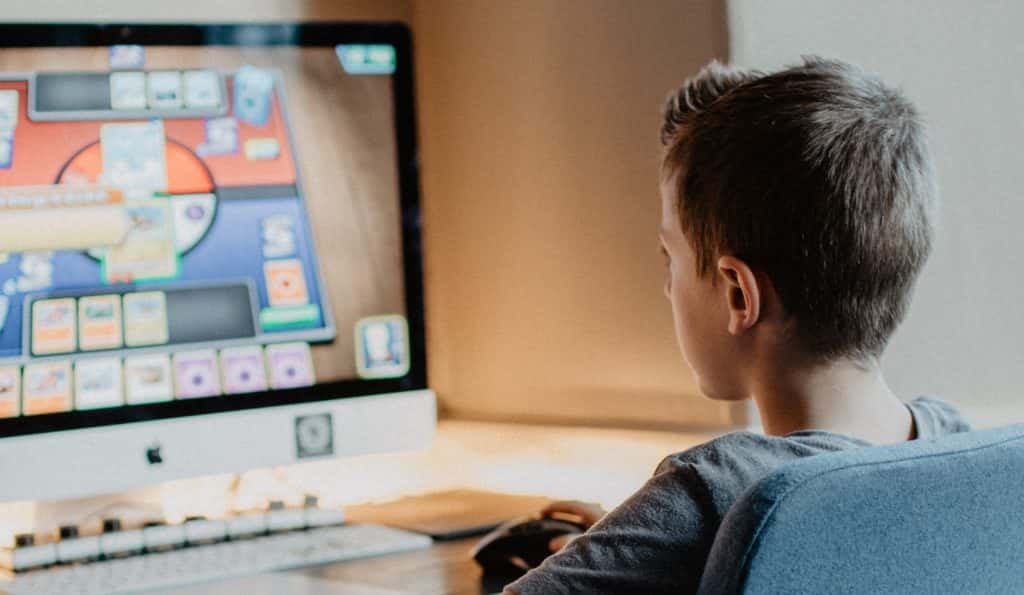 Student plays a fun educational game on an Apple computer