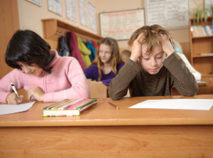 kids learning reading and writing at school