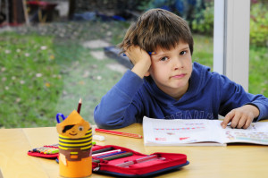 frustrated child doing homework