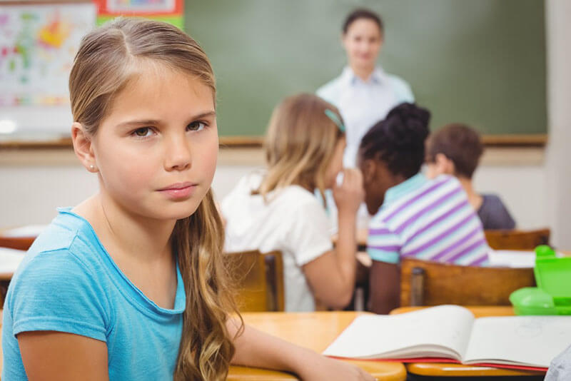 frustrated child in a school classroom