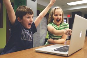 children playing video games on the computer