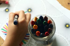 dyslexic child coloring with crayons