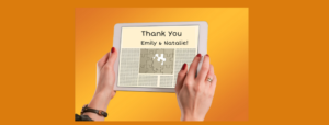 Hands holding iPad with a Thank You to Emily and Natalie displayed on the screen