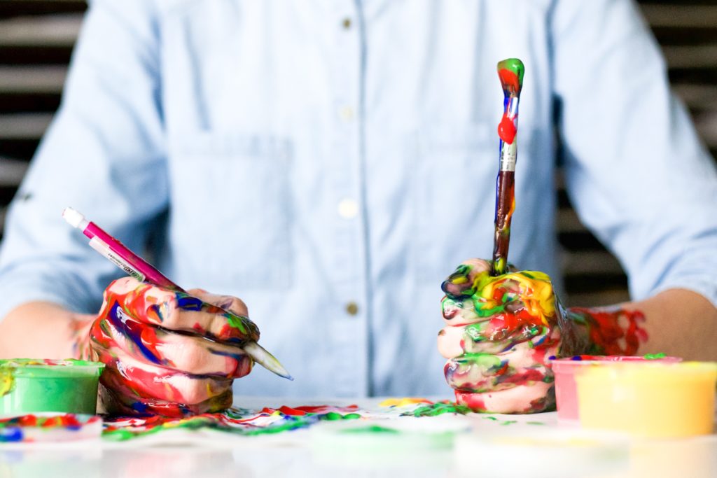 picture of hands covered in colorful paint