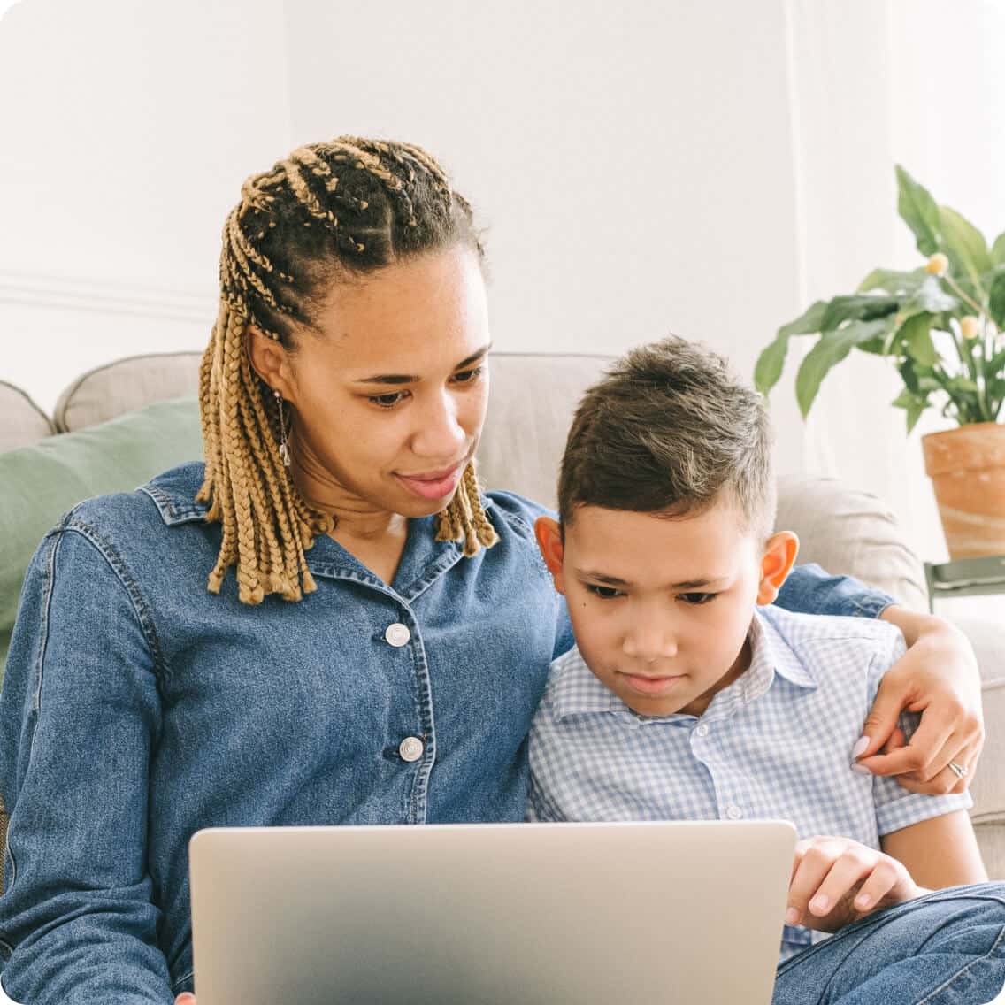 mom and son reviewing the Lexercise curriculum for dyslexia help on a laptop